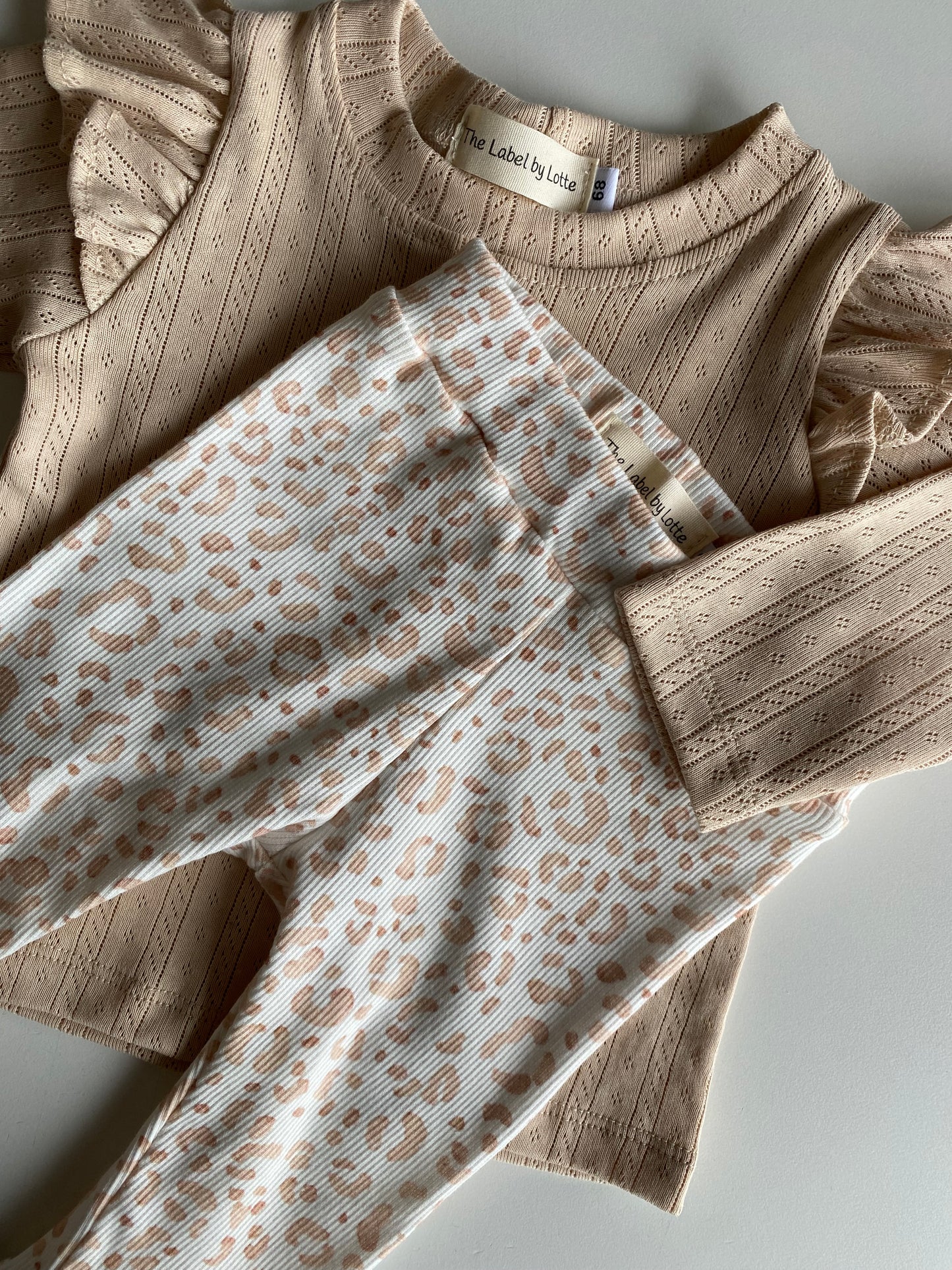 Meisjes kinderlegging Loué panterprint wit/beige