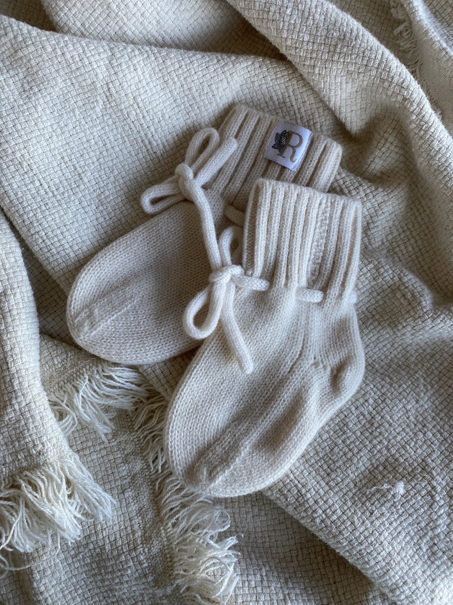 Merinowollen baby slofjes ivoor