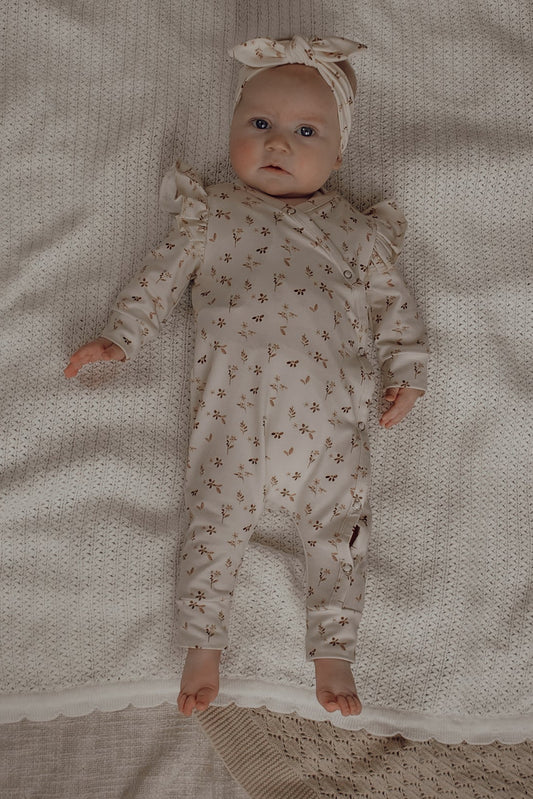 Meisjes boxpakje met bloementjes in zachtroze kleur 