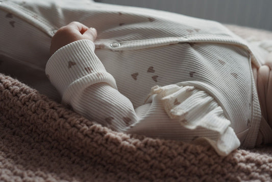 Meisjes boxpakje Lia hartjesprint beige ribstof