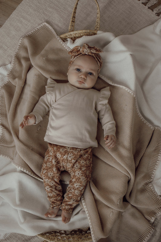 Newborn broekje Fem bloemenprint roest